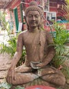 Lord Buddha's stone sculpture in a meditating position in a restaurant in Puri, Odisha