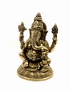 lord ganesh with four hands sitting brass statue with intricate details Royalty Free Stock Photo