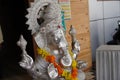 Lord Ganesha, Close up of Sculpture , Silver figure decorated with flowers, Indian Elephants. Large Silver metal statue of God