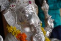 Lord Ganesha, Close up of Sculpture , Silver figure decorated with flowers, Indian Elephants. Large Silver metal statue of God