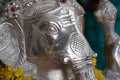 Lord Ganesha, Close up of Sculpture , Silver figure decorated with flowers, Indian Elephants. Large Silver metal statue of God