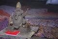 Lord Ganesha in selective focus, made of clay with colorful blur background, in indian village