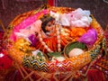 Lord Krishna idol in the jhula in the night of krishna janmashtami decorated with flower and ornaments Royalty Free Stock Photo