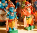 Lord Krishna and Narasimha wooden toys in retro traditional style, in showcase of indian store