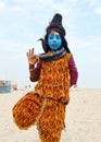 Lord shiva costume kid at Varanasi ganga ghat blue face
