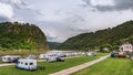 Loreley, Germany - May 24, 2019: Caravans and recreational vehicles camp on the banks of the Rhine River in the Rhine River Gorge