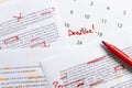 Lorem ipsum text.Closeup of calendar, documents with script and red marks.Writing story before deadline