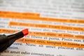 Lorem Ipsum text some lines are highlighted with orange marker stripes, selective focus