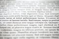 Lorem Ipsum text strings of words on printed on paper, sample document, selective focus Royalty Free Stock Photo