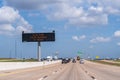 Sign says `Slow Down You`re Already in Texas