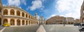 Loreto, Ancona, Italy - 8.05.2018: Panorama of Square of Loreto with background the basilica in sunny day, portico to