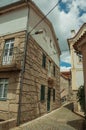 Deserted alley and old two-store house with stone wall Royalty Free Stock Photo