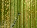 Loriol sur Drome, France - August 2022: Aerial view by a drone of a field being irrigated by powerful irrigation system.