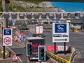 Lorries arriving at the busy Port of Dover in Kent, UK. Signage and traffic lanes are visible