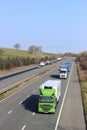 Lorries on M6 motorway in countryside near Borwick