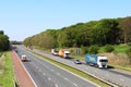 Lorries and other vehicles, motorway on sunny day Royalty Free Stock Photo