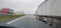 Overtake trucks at high speed on the motorway