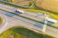 Lorries transporting cargo along main road in rural area. Aerial Royalty Free Stock Photo