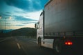 Lorry car drive on road in evening. Truck transport cargo. Transportation and shipment. Speed and delivery concept Royalty Free Stock Photo