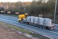 Lorry carrying builidng materials in motion on the British motorway M1 Royalty Free Stock Photo