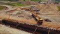 Lorry crane and a truck concrete mixer. Open-cut trench excavation and underground utility construction in Warsaw Royalty Free Stock Photo