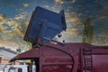 Lorry truck loading a skip waste management container