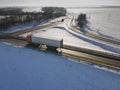 Lorry truck on the road surrounded by winter fields