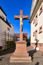 Lorsch, Germany - Religious cross with Jesus sculpture with golden clothes