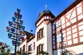 Lorsch, Germany - Traditional guild pole and part of old historic city hall building in front of blue sky