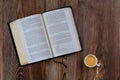 Open Bible morning readings on a table top with coffee cup Royalty Free Stock Photo