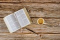 Open Bible morning readings on a table top with coffee cup and eyeglasses Royalty Free Stock Photo