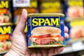 Los Angeles, CA/USA 9/23/2020 Customer hand holding a Tin can of SPAM brand Meat in a supermarket aisle