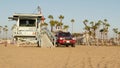 LOS ANGELES CA USA - 16 NOV 2019: California summertime Venice beach aesthetic. Iconic retro wooden lifeguard watchtower, baywatch