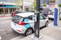 Electric cars for sharing parked along a street in Los Angeles downtown