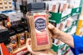 Los Angeles, CA/USA 08/09/2019 Shoppers hand holding a Plastic Jar of Nestle Nescafe Tasters Choice brand instant coffee