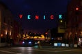 Los Angeles, California - December 29, 2022: City Lights and Venice Nights - The Glowing Sign in Focus