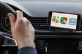 LOS ANGELES, CALIFORNIA - JUNE 6, 2019: Close up to male driving and using different navigation application Google maps, Apple