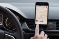 LOS ANGELES, CALIFORNIA - JUNE 6, 2019: Close up to male driving and using navigation appliction Google Maps. Get direction. An