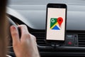 LOS ANGELES, CALIFORNIA - JUNE 6, 2019: Close up to male driving and using navigation appliction Google Maps. Get direction. An Royalty Free Stock Photo