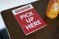 Grubhub pick up here sign on table