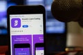 Los Angeles, California, USA - 16 April 2020: Knowin Learn Coding logo on screen close up. App store icon visible on phone display