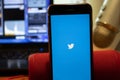Los Angeles, California, USA - 16 April 2020: Twitter logo on screen close up. App store icon visible on phone display,