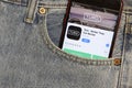 Los Angeles, California, USA - 5 December 2019: Turo app icon on phone screen in blue jeans pocket. App Store logo on Iphone with