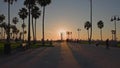 LOS ANGELES, CALIFORNIA, USA - December 10, 2020: Venice Ocean Beach skatepark. Silhouette of young jumping skateboarder