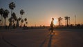 LOS ANGELES, CALIFORNIA, USA - December 10, 2020: Venice Ocean Beach skatepark. Silhouette of young jumping skateboarder