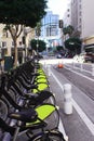Bicycle parking in downtown Los Angeles next to the road. Bicycles for rent Royalty Free Stock Photo