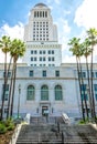 American flags on the stately facade of the City Hall skyscraper in Los Angeles