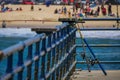 Los Angeles, California, USA, JUNE, 15, 2018: Outdoor view of fishing rods standing in a wooden pier used for people Royalty Free Stock Photo