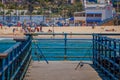 Los Angeles, California, USA, JUNE, 15, 2018: Outdoor view of fishing rods standing in a wooden pier used for people Royalty Free Stock Photo