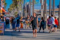 Los Angeles, California, USA, JUNE, 15, 2018: Outdoor view of unidentified people walk along the Venice Beach Boardwalk Royalty Free Stock Photo
